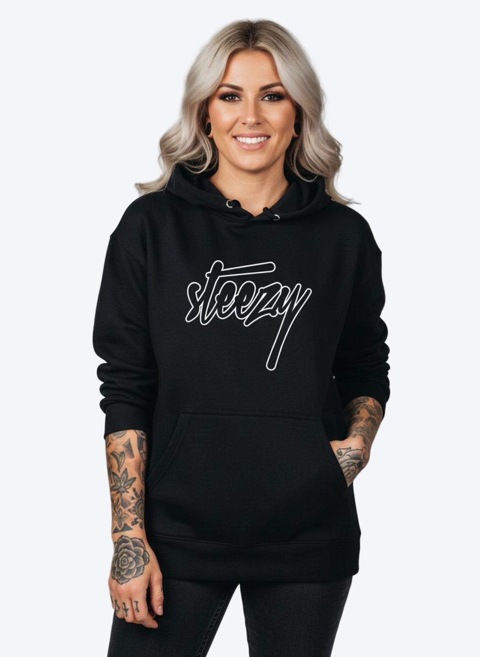 Person wearing a black hoodie with 'steezy' logo on a gray background